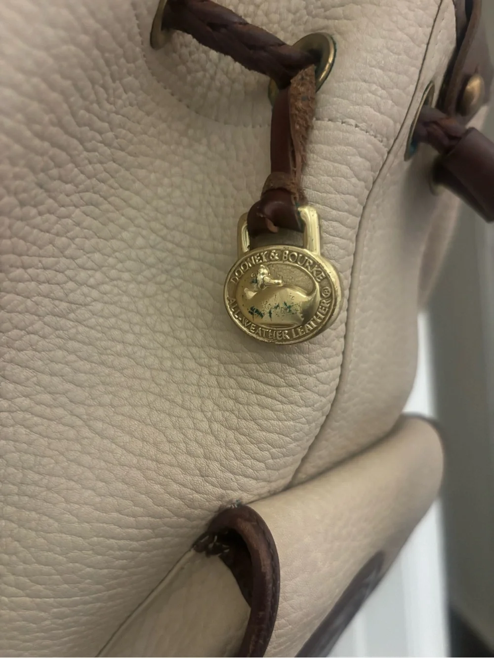 Dooney & Bourke Beige and Brown Leather Drawstring Bucket Backpack